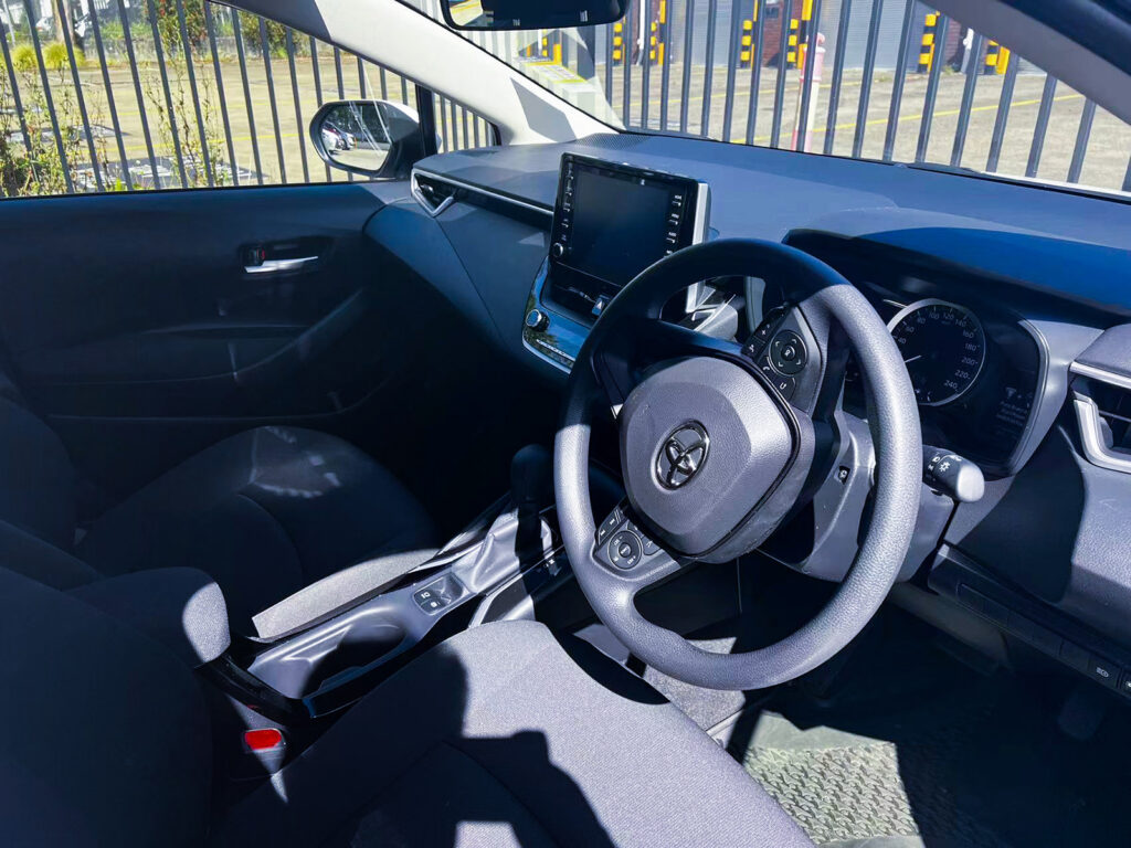Booknride rental Toyota Corolla Hybrid interior driver side